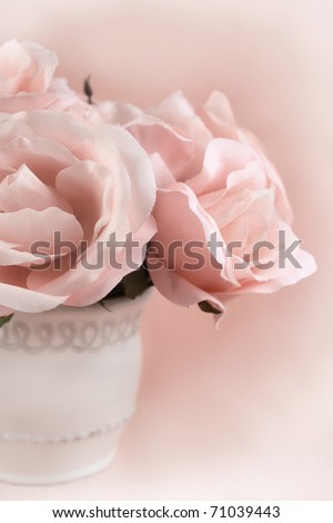 Centerpiece of sepia  roses on a pretty feminine background with copy space