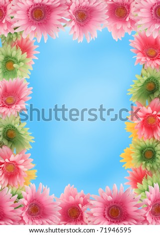 Pretty colorful gerber daisy border or  frame with spring colors on blue sky background