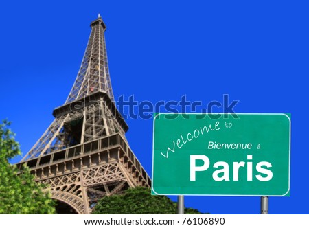 Welcome to Paris sign in English and French with the Eiffel  Tower, in  France under a sunny, clear, bright blue sky