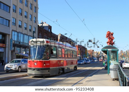 TORONTO, ON, February 9: Spadina street in Chinatown showing city transportation streetcar. The TTC operates the third most heavily used urban mass transit system