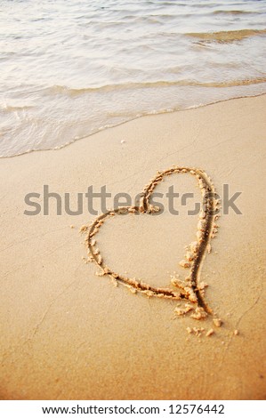 heart drawing in the sand beach