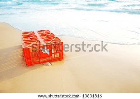 empty plastic box pollution in sand beach