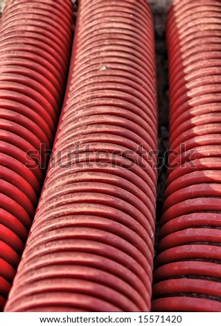 red plastic pipes industrial texture