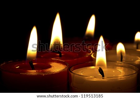 Close up of tea light candle flames