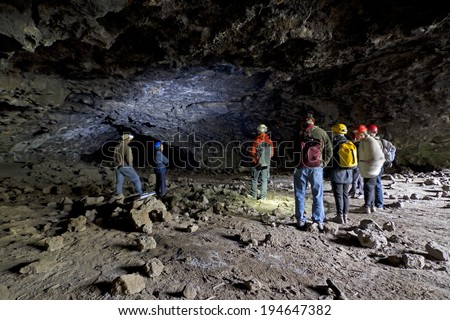 BEND, OR - May 10: Group of  people doing cave study in lava tube cave in Bend, OR  May 10, 2014