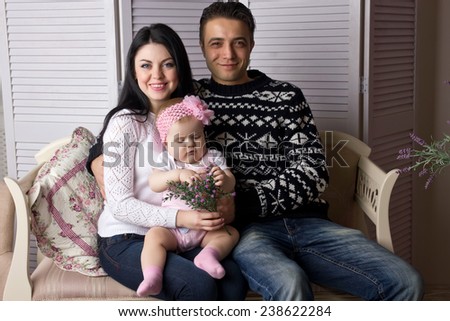 Family sitting on the couch at home