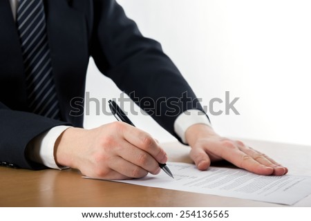 Hands signing business documents. Signing papers. Lawyer, realtor, businessman sign documents.