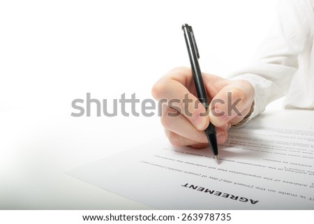 Businessman\'s hand signing papers. Lawyer, realtor, businessman sign documents on white background. Copy space for text.