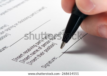 Businessman\'s hand signing papers. Lawyer, realtor, businessman sign documents on white background. Copy space for text