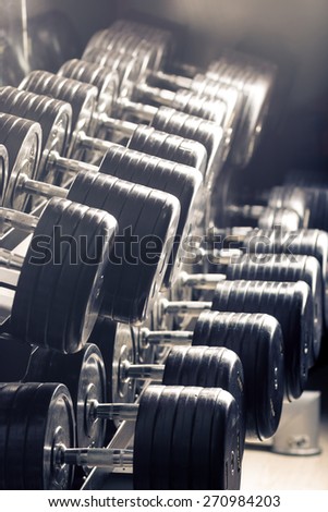 Gym equipment. Sport background. Dumbbell. Copy space.