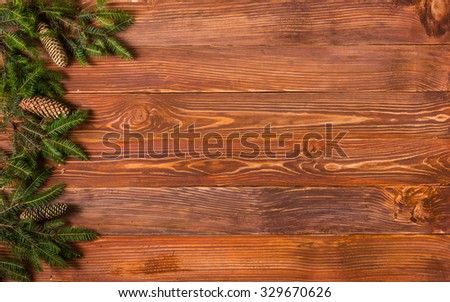 Christmas rustic background - vintage planked wood with Christmas fir tree and free text space.