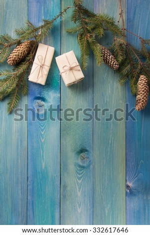 Christmas rustic background - vintage planked wood with Christmas fir tree and free text space. Winter holidays concept. Copy space for your text. Merry Christmas and happy new year!