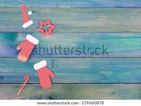 Christmas rustic background - vintage planked wood with Christmas fir tree and free text space. Top view of snowflakes, gift boxes, decoration on blue grunge wooden deck table. Winter holidays concept