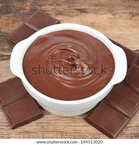 Chocolate cream with chocolate segments close up