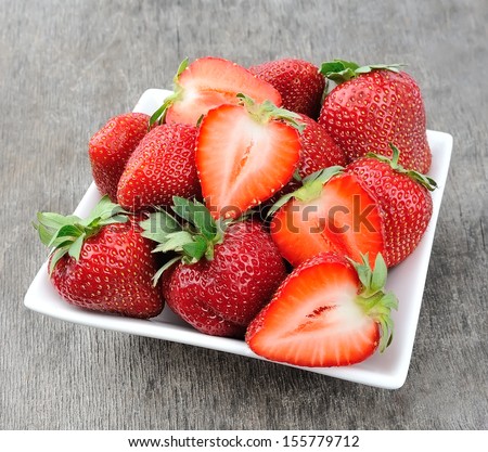 Ripe Red Strawberries On An Old Wooden Textured Table