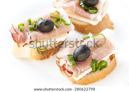 small sandwich with parma ham and camembert
