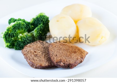 Beef cutlets with potatoes and broccoli
