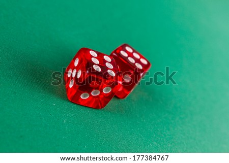 Red dice on green felt