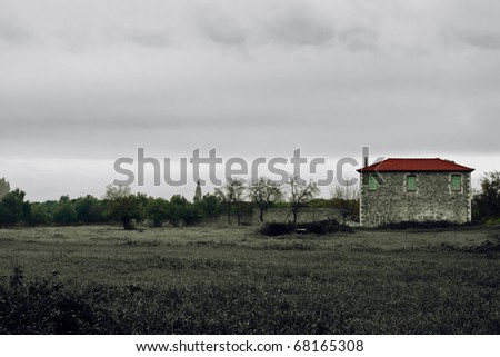Agricultural building on foggy field