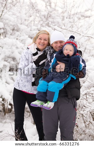 young family in the snow