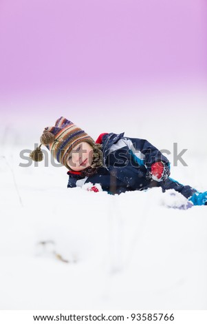 small child outside in the snow