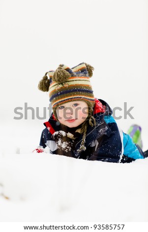 small child outside in the snow