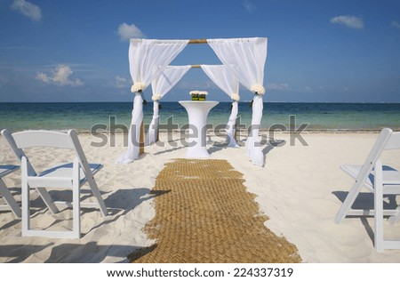 Caribbean wedding setup on tropical beach.