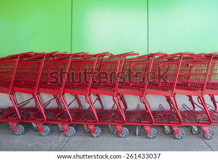 Red shopping carts at grocery store.