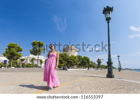 Girl posing in front of the white tower , Thessaloniki city in Greece