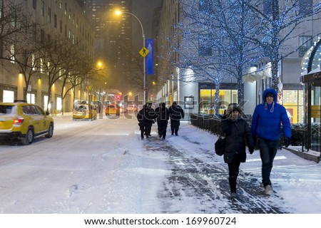 NEW YORK CITY - JAN 3: A fast-moving snowstorm arrived in the New York area.The chilly weather and falling snow caused many troubles to the New Yorkers, January 3, 2014 in Manhattan, New York City