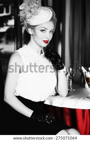 Beautiful blonde bride seats near table, is ready for a new bright life, inside interior. White Wedding dress. Pretty young woman love. Black and Red colour.