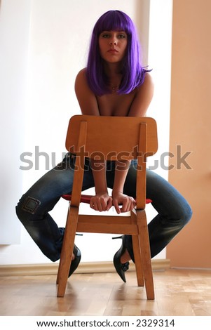 Sexy beautiful women  chair with violet hair.