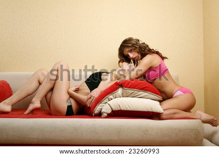 Two models posing on the sofa.