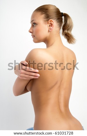 stock photo Back of nude beautiful girl on grey background