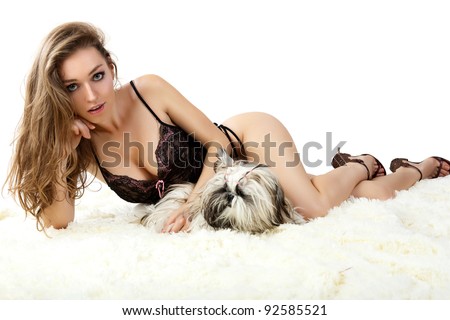 stock photo Sensual women in black lingerie with puppy
