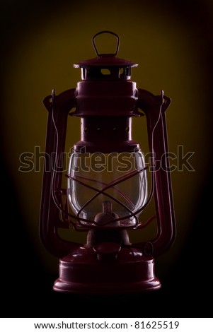 Red oil lamp on a dark Yellow background