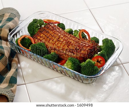 A pork loin roast over a white background