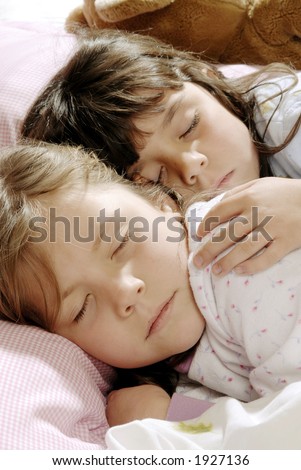 stock photo two small girls sleeping together Save to a lightbox 
