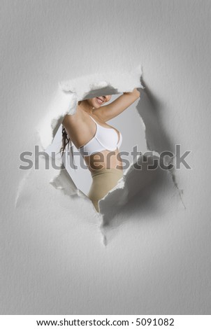 detail of woman seen through a hole in a blackboard