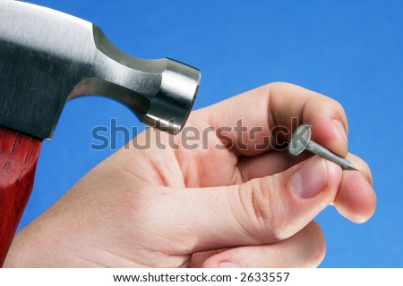 Man hammering a nail, signs and symbols of repair or construction, diy.