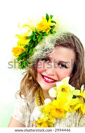 Beautiful smiling girl with narcissus in her hair