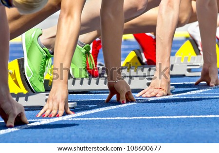 Female sprinters in start block