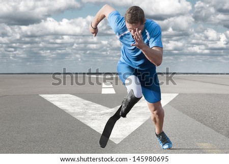 Disabled athlete with  explosive start on the runway