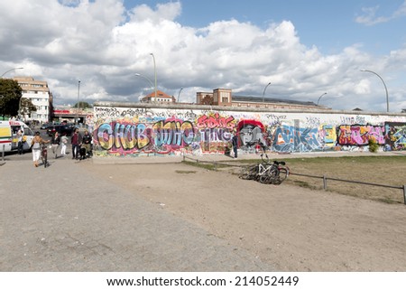 BERLIN - AUGUST 24, 2014 : The East Side Gallery is the largest outdoor art gallery in the world. This is a graffiti of the brotherly kiss of former politicians  Breschnew and Honecker.