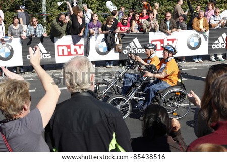 BERLIN - SEPTEMBER 25: Thirty-eighth Berlin  Marathon handbiker mass start on September 25,  2011 in Berlin, Germany.