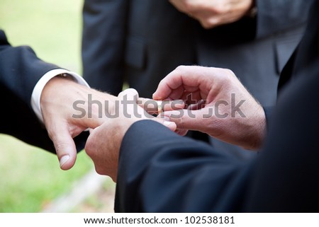 Stock Photo One Groom Placing The Ring On Another Man S Finger During Gay Wedding 102538181 