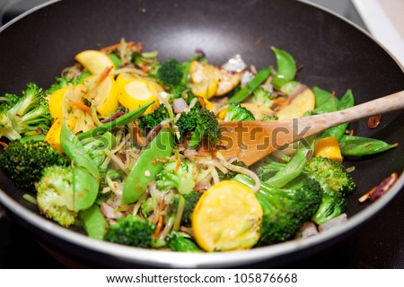 Healthy vegetable stir fry cooked in a Chinese style wok. - stock photo