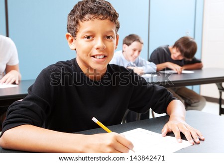 Handsome mixed-race student in class ready to learn Handsome mixed-race student in class ready to learn