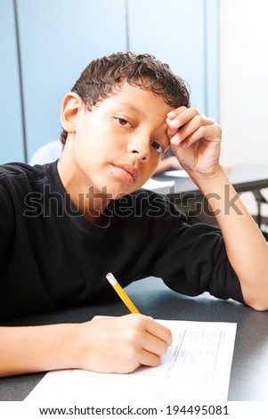 Teen boy worried about taking a standardized test.
