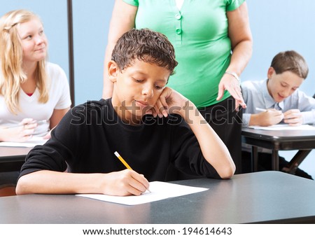 Student struggling with a standardized test in school.
